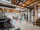 Spacious basement with workout equipment and colorful flooring, perfect for a home gym at 353 Zuniga St, Brighton, CO 80601