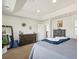 Spacious bedroom features a large mirror, contemporary furniture, and decor at 353 Zuniga St, Brighton, CO 80601