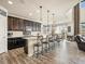 Open-concept kitchen with a breakfast bar and an adjacent dining area with abundant natural light at 353 Zuniga St, Brighton, CO 80601