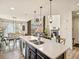 Stylish kitchen with an island overlooking the living room with lots of natural light at 353 Zuniga St, Brighton, CO 80601