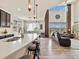 Open kitchen featuring large island, breakfast bar, and view into the adjacent living space at 353 Zuniga St, Brighton, CO 80601