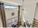 Bright living room with high ceilings, modern ceiling fan, a leather sofa set, and a fireplace at 353 Zuniga St, Brighton, CO 80601