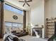 Living room showcasing a cozy fireplace with stone surround and wooden mantle at 353 Zuniga St, Brighton, CO 80601