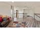 Spacious loft with railing overlooking the living room, features hardwood floors and ample lighting at 353 Zuniga St, Brighton, CO 80601
