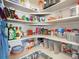 Well-stocked pantry with organized shelving and various food items for convenient storage and access at 353 Zuniga St, Brighton, CO 80601