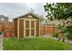 Well-maintained storage shed in a backyard setting, offering additional storage space at 353 Zuniga St, Brighton, CO 80601