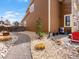Side yard with a gravel path, well, and compact outdoor grill area, perfect for intimate gatherings at 353 Zuniga St, Brighton, CO 80601