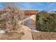 A home with a front porch and mature shrubs at 2730 N Columbine St, Denver, CO 80205