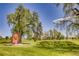 Landscaped golf course with mature trees and art at 2730 N Columbine St, Denver, CO 80205