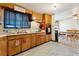 Retro kitchen features wood cabinets and gas range at 2730 N Columbine St, Denver, CO 80205