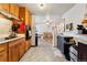 View of kitchen with wood cabinets and tiled floor at 2730 N Columbine St, Denver, CO 80205
