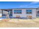 The backyard of the property in construction, with covered porch and new windows at 39555 Gwinett Cir, Elizabeth, CO 80107
