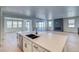 Modern kitchen featuring white cabinetry, a center island, and stainless steel appliances at 39555 Gwinett Cir, Elizabeth, CO 80107