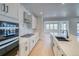 Modern kitchen featuring white cabinetry, a center island, and stainless steel appliances at 39555 Gwinett Cir, Elizabeth, CO 80107