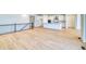 Spacious, open-concept living room with hardwood floors, seamlessly connecting to the kitchen for modern living at 39555 Gwinett Cir, Elizabeth, CO 80107