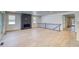 Spacious living room with hardwood floors, a modern fireplace, and plenty of natural light at 39555 Gwinett Cir, Elizabeth, CO 80107