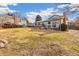 Wide shot of backyard featuring mature trees and home exterior at 3915 E Jamison Pl, Centennial, CO 80122