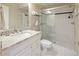 Bathroom featuring granite countertop, tile flooring, and a glass enclosed shower at 216 N Monroe St, Denver, CO 80206