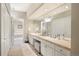 Spacious bathroom with double sinks and vanity. Features tub and walk-in shower at 216 N Monroe St, Denver, CO 80206