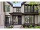 Inviting home featuring shuttered windows, gray siding, a front garden and covered entryway at 216 N Monroe St, Denver, CO 80206