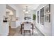 Charming dining room with modern lighting and nearby kitchen at 10836 W Evans Ave # 32, Lakewood, CO 80227