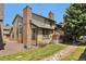 Back of home, showing well maintained grass and shrubs at 10836 W Evans Ave # 32, Lakewood, CO 80227