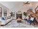 Inviting living room features vaulted ceiling, fireplace, and staircase at 10836 W Evans Ave # 32, Lakewood, CO 80227