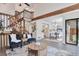 Sun-lit living room with a view of the dining area and staircase at 10836 W Evans Ave # 32, Lakewood, CO 80227