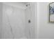 Sleek bathroom shower with marble tile and modern fixtures at 10836 W Evans Ave # 32, Lakewood, CO 80227