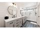 Bathroom with double vanity, large shower, and patterned floor at 30796 Burland Rd, Golden, CO 80403