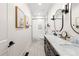 Modern bathroom with double vanity, marble countertop, and bathtub at 30796 Burland Rd, Golden, CO 80403