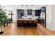 Open concept kitchen with island seating and hardwood floors at 30796 Burland Rd, Golden, CO 80403