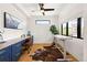 Home office with standing desk and built-in cabinets at 30796 Burland Rd, Golden, CO 80403
