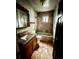 Bathroom featuring a vanity, toilet, tub, and shower at 2835 Cherry St, Denver, CO 80207