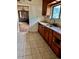 Bright kitchen view showcasing tile floors, wooden cabinets, and an undermount sink at 2835 Cherry St, Denver, CO 80207