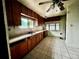 Spacious kitchen features wooden cabinets and tile flooring at 2835 Cherry St, Denver, CO 80207