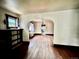 Sunlit living room featuring hardwood floors and archway at 2835 Cherry St, Denver, CO 80207