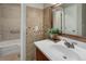 Bathroom with a white vanity and tile accents at 3550 S Harlan St # 259, Denver, CO 80235