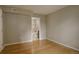 Bedroom with wood floors and an ensuite bathroom featuring a walk-in shower at 3550 S Harlan St # 259, Denver, CO 80235