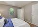 Cozy bedroom with a window view and closet at 3550 S Harlan St # 259, Denver, CO 80235