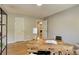Bright home office featuring a desk, a window view, modern decor and wood floors at 3550 S Harlan St # 259, Denver, CO 80235