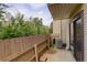 Private patio area with wood fencing creating a cozy outdoor space, plus sliding glass doors at 3550 S Harlan St # 259, Denver, CO 80235