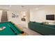 Finished basement with a pool table and cozy seating area, perfect for entertaining guests at 2163 S Grant St, Denver, CO 80210