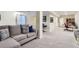 Finished basement featuring a comfortable couch and space for an office and entertainment at 2163 S Grant St, Denver, CO 80210