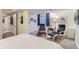 Inviting bedroom showcasing a reading nook with comfortable chairs and ambient lighting at 2163 S Grant St, Denver, CO 80210