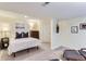 Cozy bedroom featuring neutral tones, comfortable furnishings, and decorative wall art at 2163 S Grant St, Denver, CO 80210