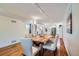 Dining room with wooden table, seating for six, and modern lighting at 2163 S Grant St, Denver, CO 80210