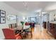 Bright dining room with hardwood floors and a large wooden table, connected to the living area at 2163 S Grant St, Denver, CO 80210