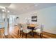 Open dining area featuring hardwood floors, modern decor, and stylish lighting at 2163 S Grant St, Denver, CO 80210