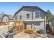 Backyard deck featuring a grill, dining table, and awning for shade at 2163 S Grant St, Denver, CO 80210